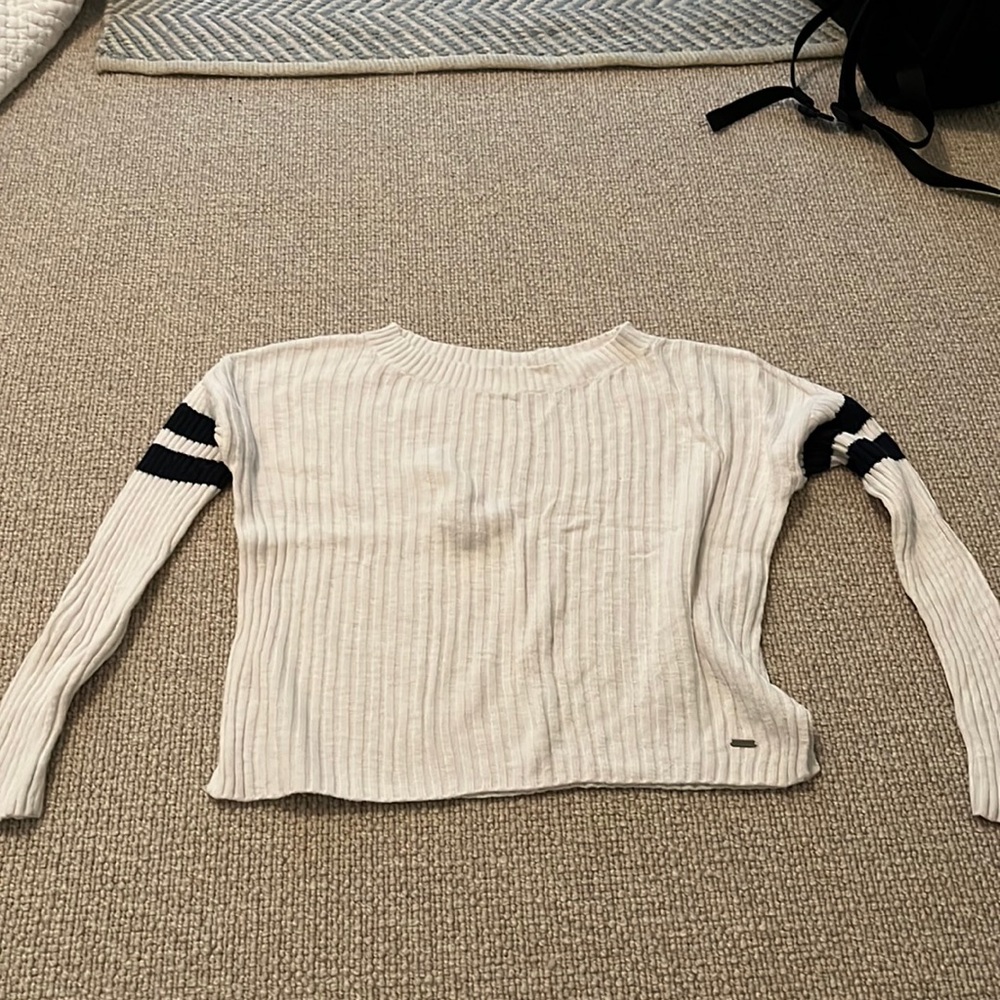 White with blue stripes on arms sweater